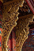 Wat Xieng Thong temple in Luang Prabang, Laos. the Ho Tai, the library. Detail of the console of the roof. 